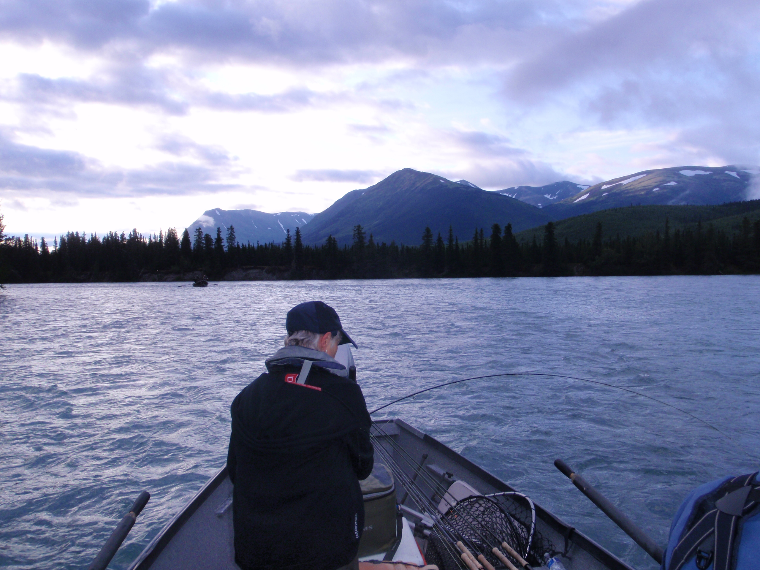 Woman fishing at dawn.