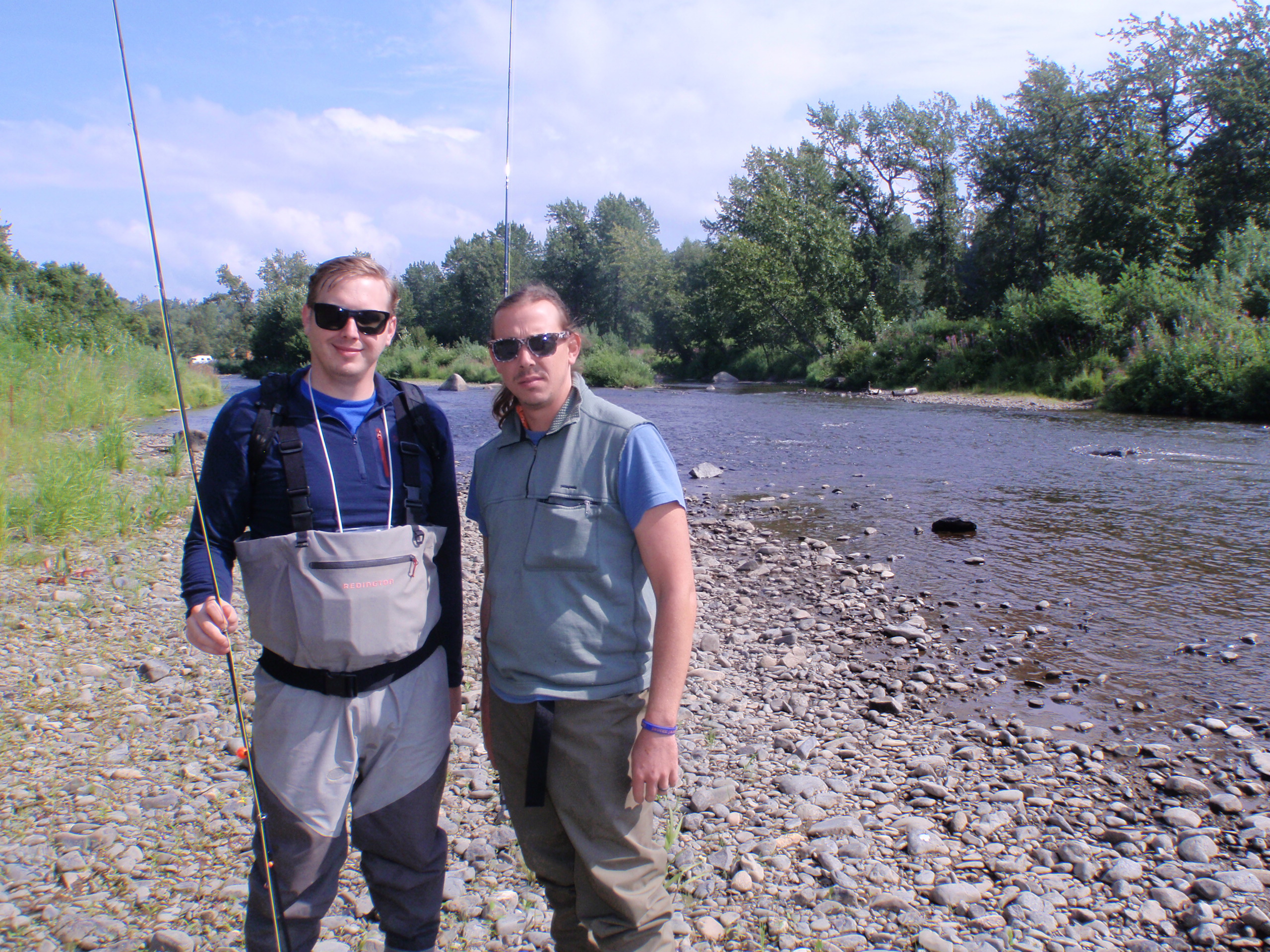 Two brothers posing by the river.