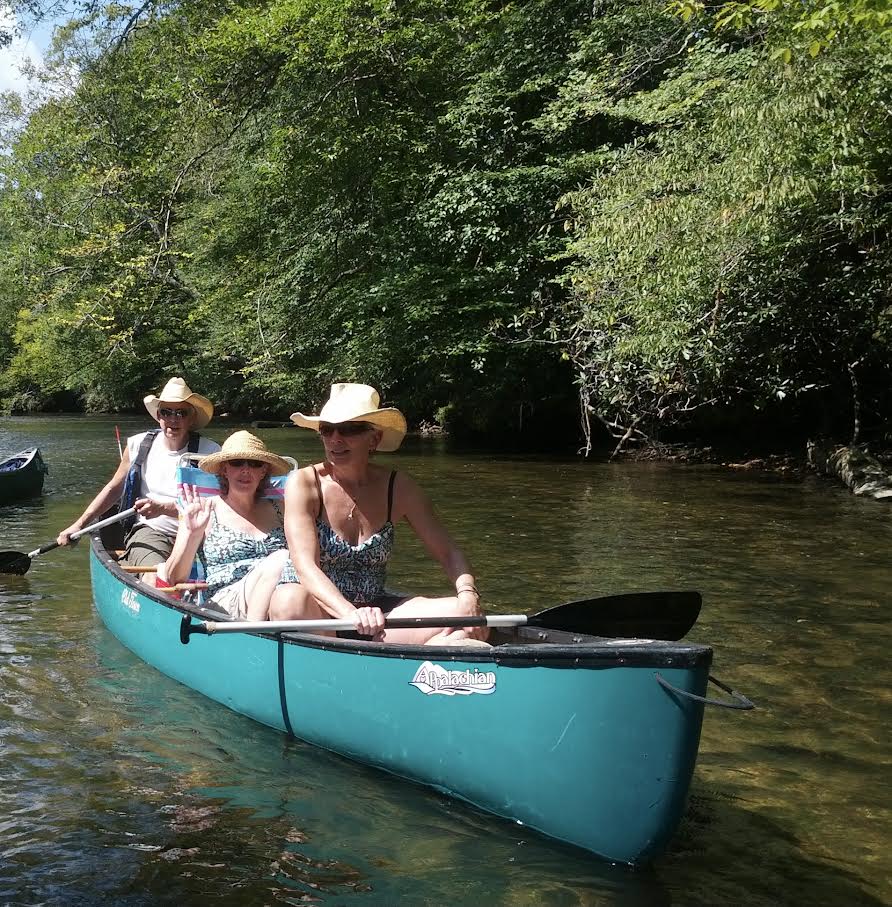 Three people in a canoe.