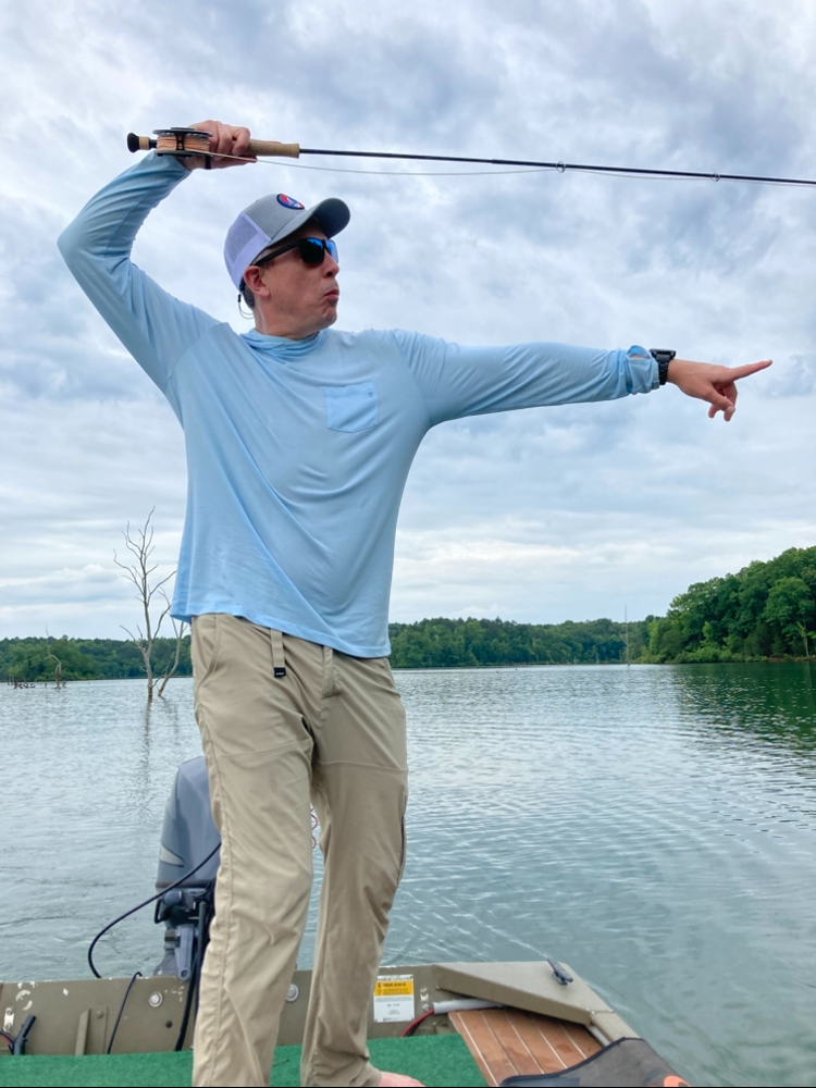 Man goofing of while fishing.
